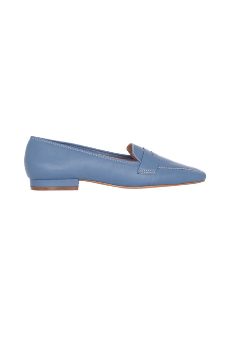 Blue flat shoe on a white background