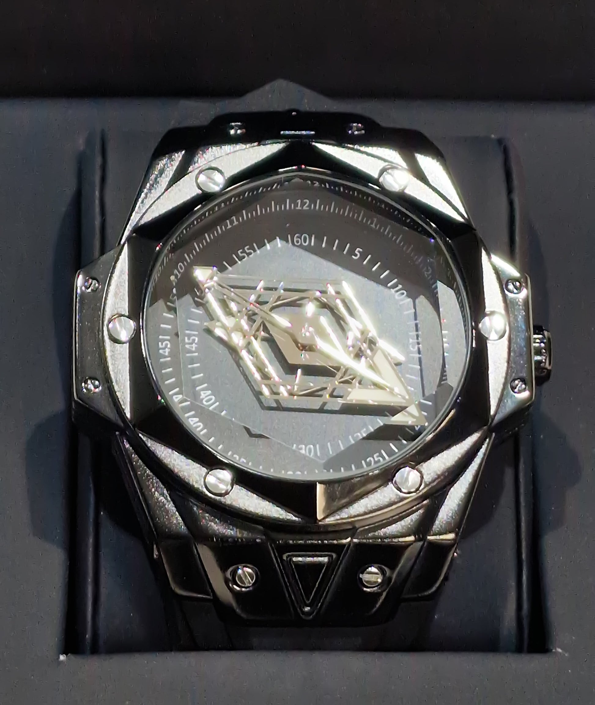 Luxury watch with intricate design on a black background