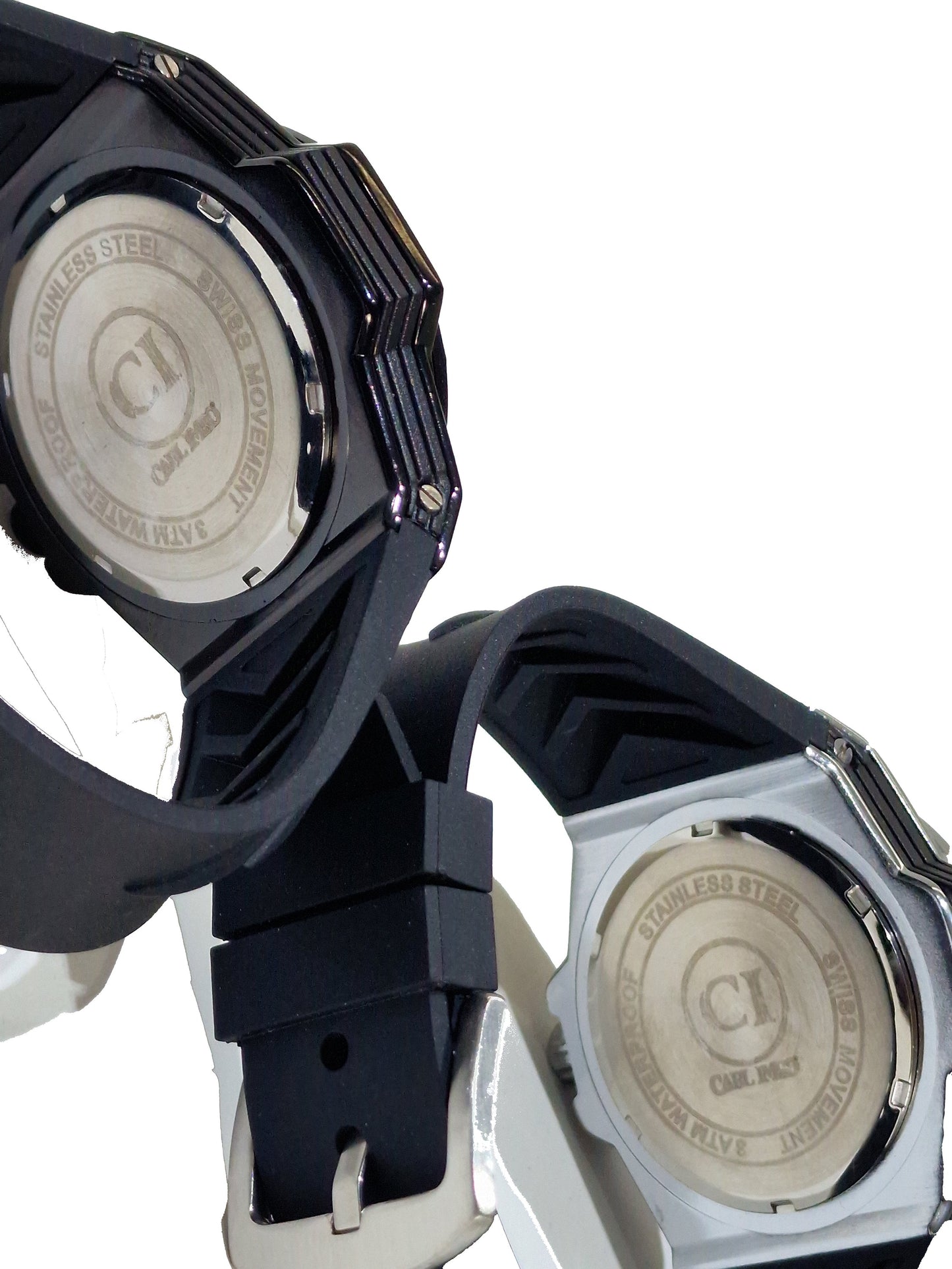 Two Casio watches with metallic backs on a white background