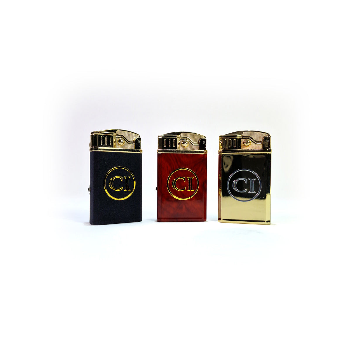 Three Clic Lighter brand lighters in black, red, and gold on a white background