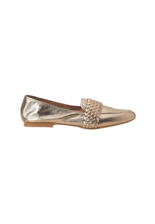 Gold metallic loafer with decorative element on a white background