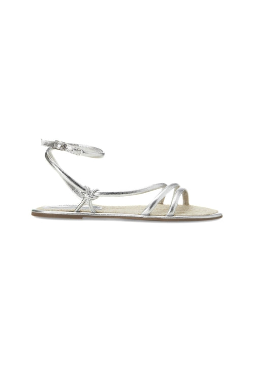 Silver sandal with thin straps on a white background