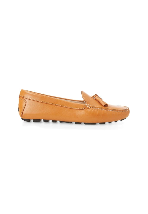 Tan leather loafer with a tassel on a white background