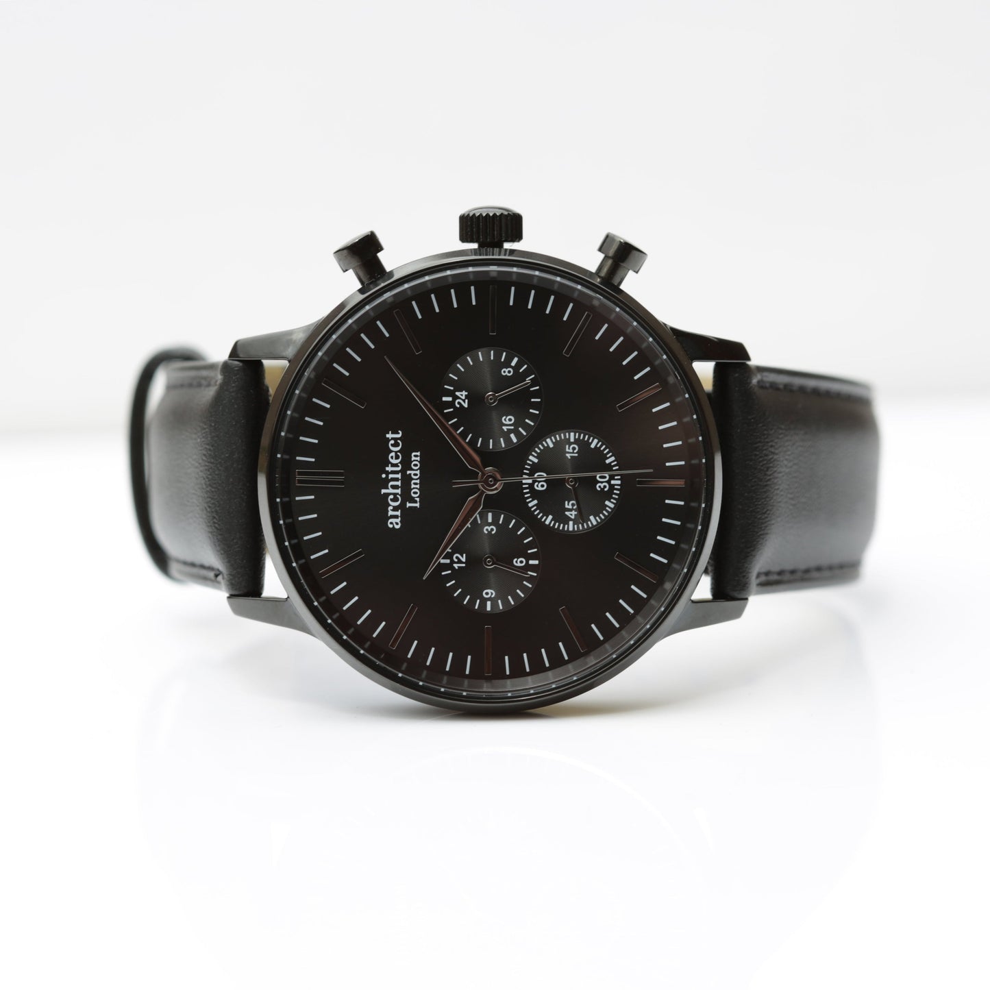 Black watch with a leather strap on a white background