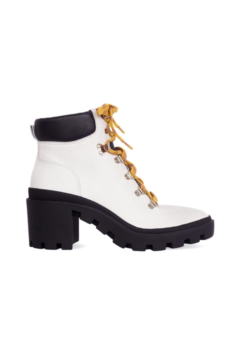 White boot with gold chain details on a white background