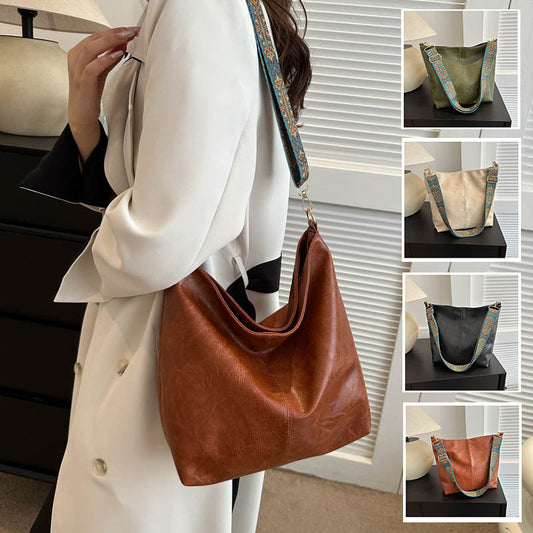 Brown leather handbag held by a person wearing a white coat, with additional images of the bag on a table.