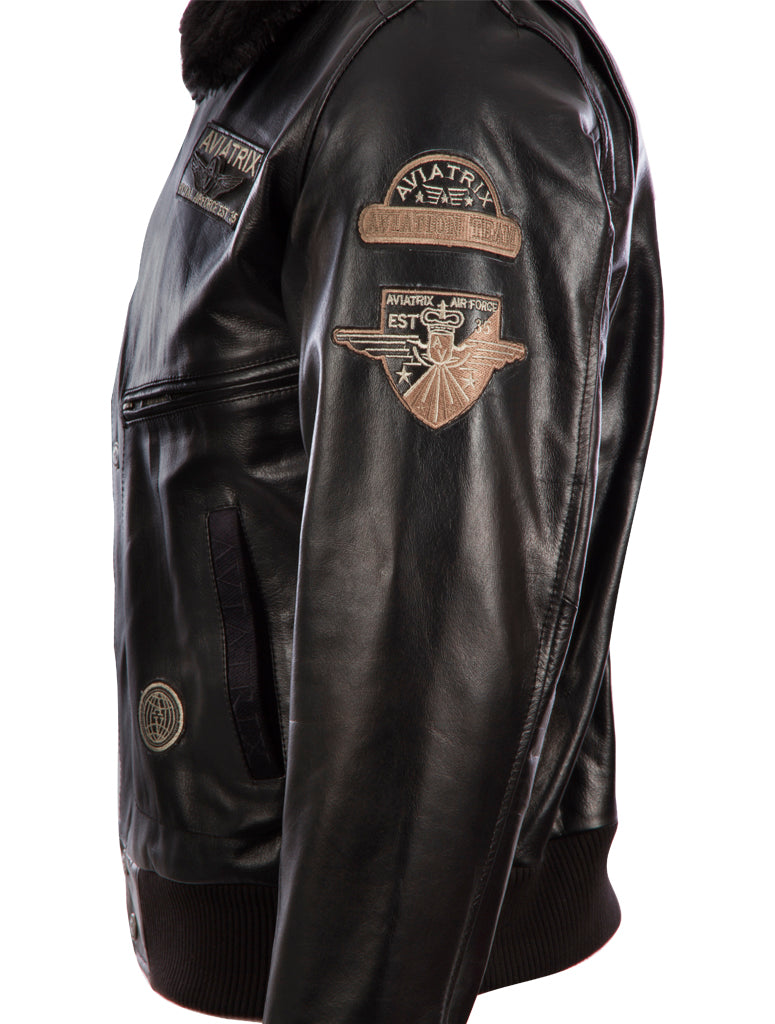 Black leather jacket with patches on a white background left side view
