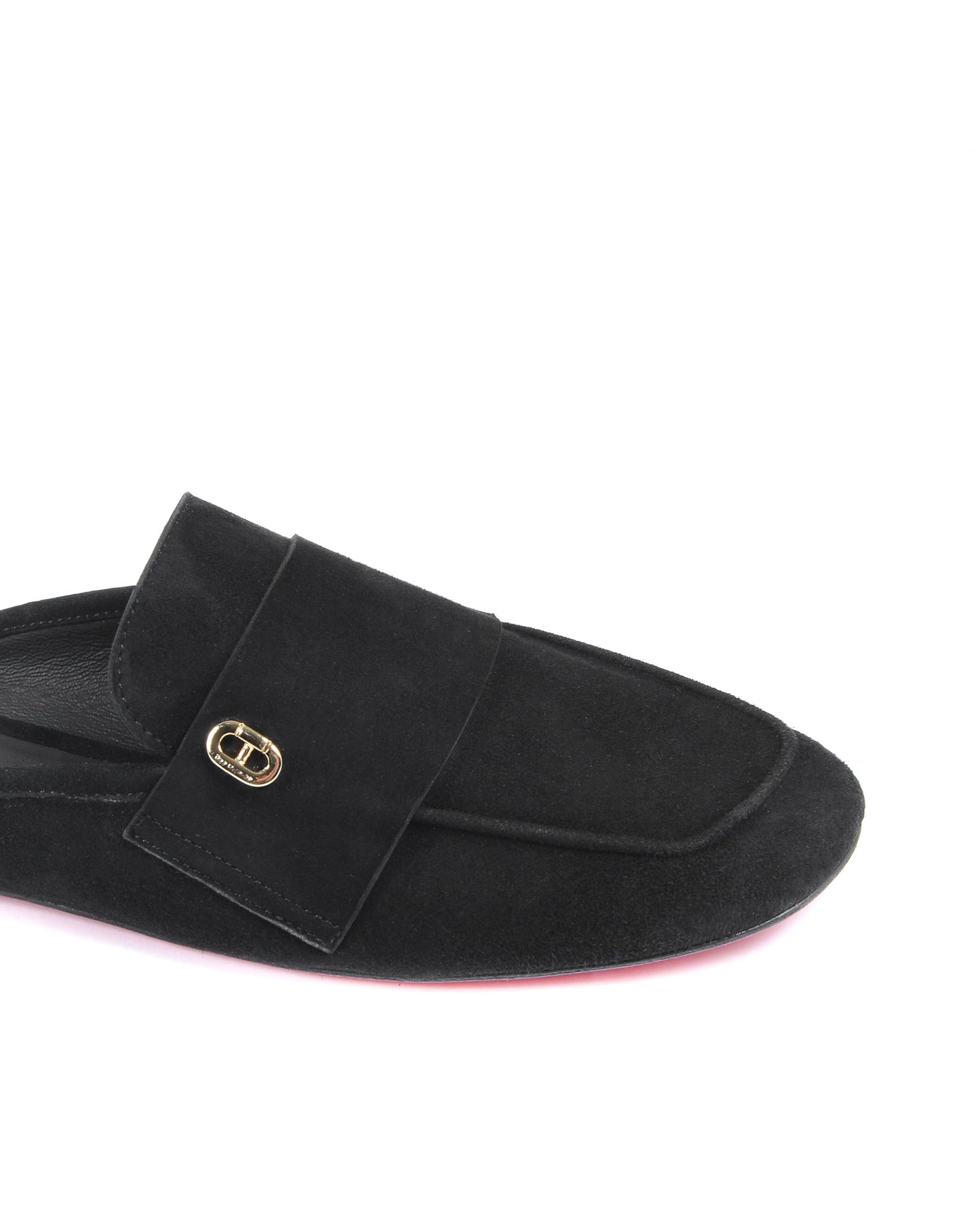 Black slipper with a gold buckle on a white background