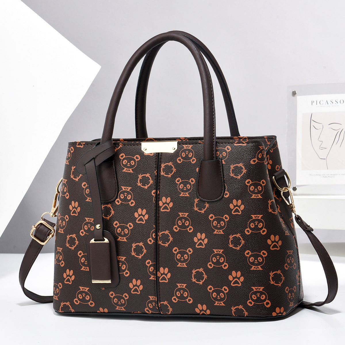 Brown handbag with animal pattern on a white surface