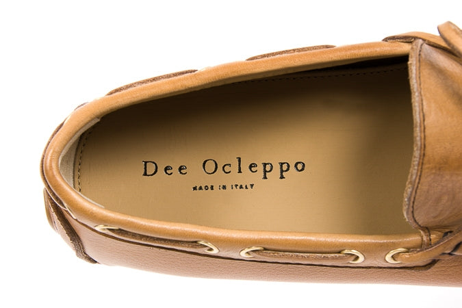 Brown leather shoe with 'Dee Ocleppo' branding on a white background