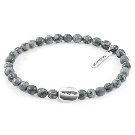 Gray beaded bracelet with a silver tag on a white background