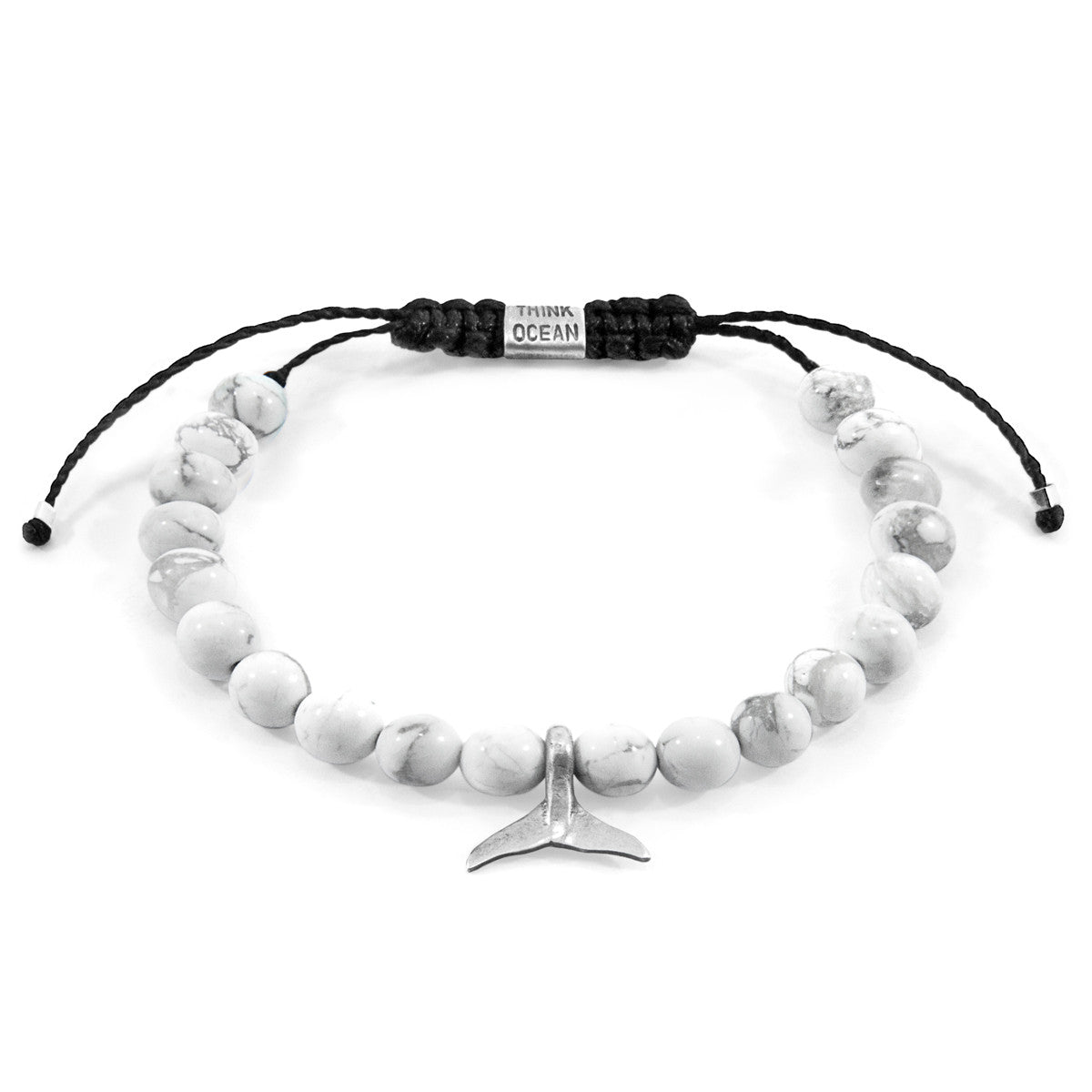 Bracelet with white beads and a silver fish tail charm on a white background