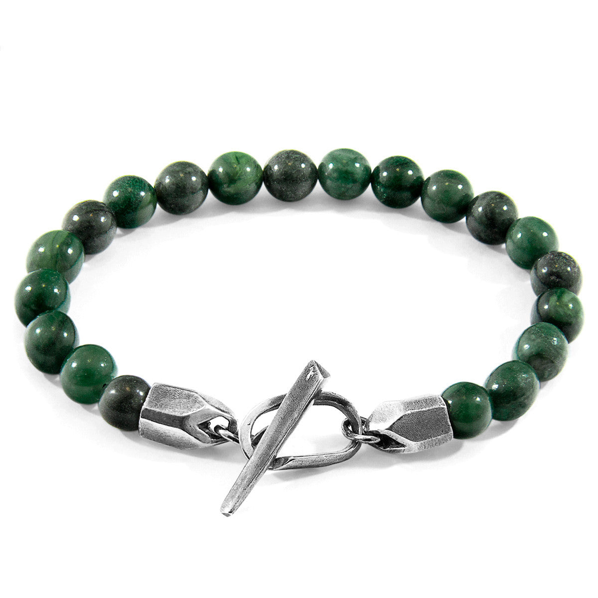 Green beaded bracelet with a silver clasp on a white background