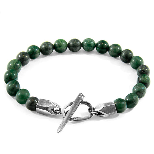 Green beaded bracelet with a silver clasp on a white background