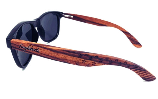 Sunglasses with wooden frame and 'Engleberts' branding on a white background