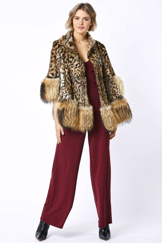 Woman wearing a leopard print fur coat over a burgundy outfit on a white background