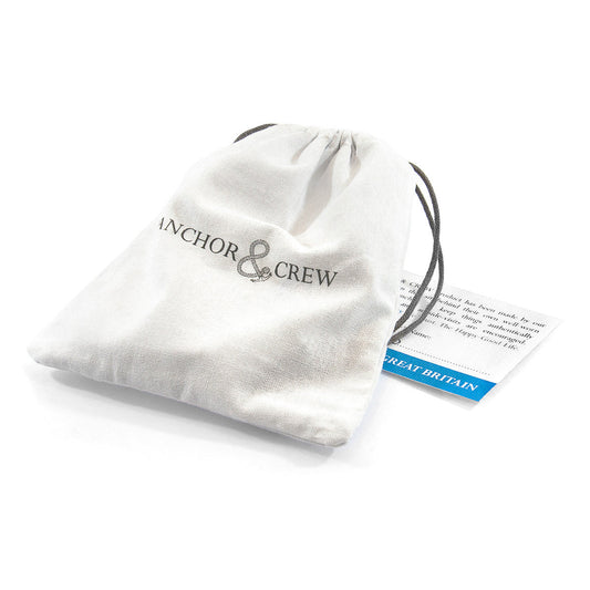 White drawstring bag with 'Anchor & Crew' branding on a white background