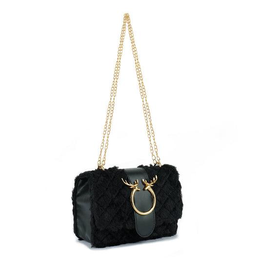 Black handbag with gold chain and deer head design on a white background