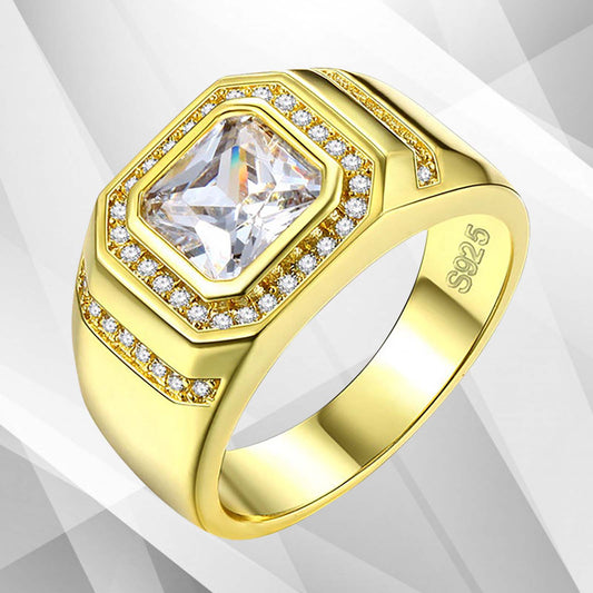 Gold ring with a large central gemstone and smaller stones on a light gray background