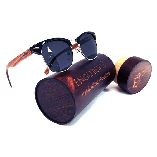 Sunglasses with wooden frame and case on a white background, featuring the brand 'Engleberts'.