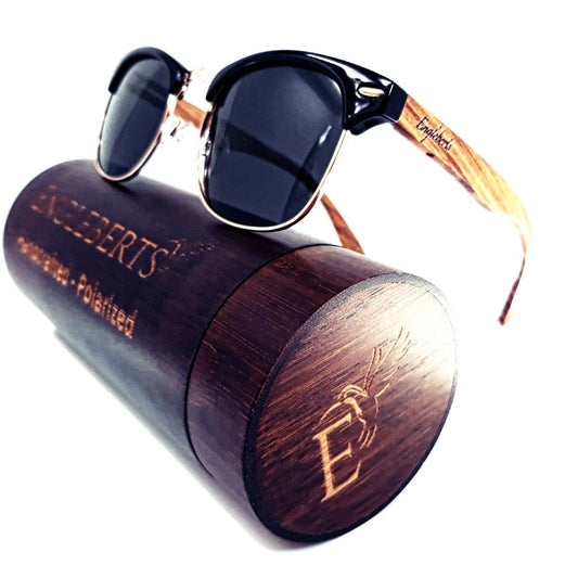 Sunglasses with wooden case on a white background