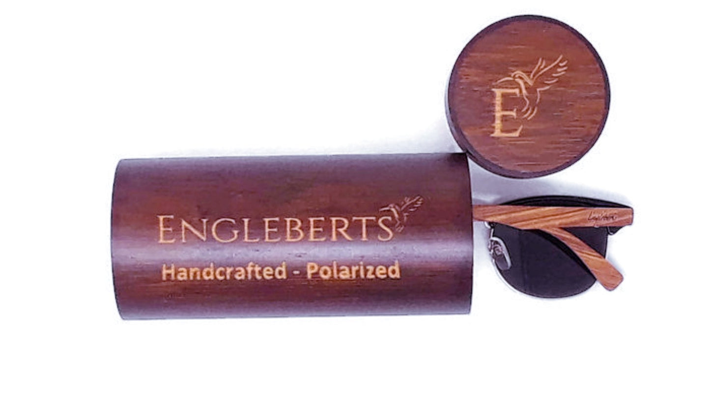 Wooden sunglasses case with 'Engleberts' branding on a white background