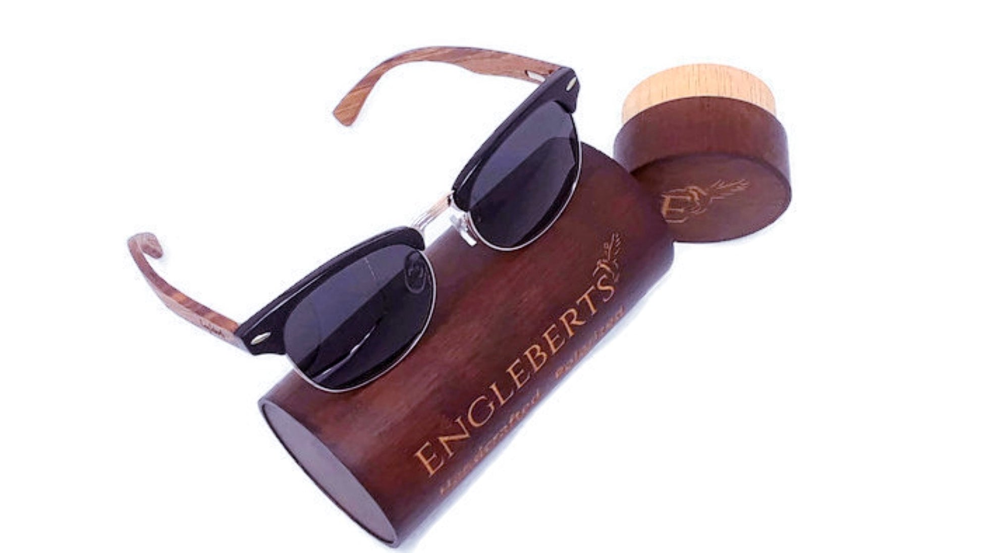 Sunglasses with wooden case branded 'Engleberts' on a white background