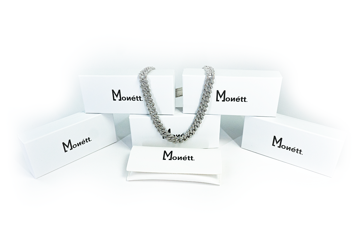 Silver chain necklace on a white background with 'Monett' branding.