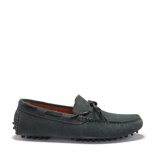 Green suede loafer shoe on a white background