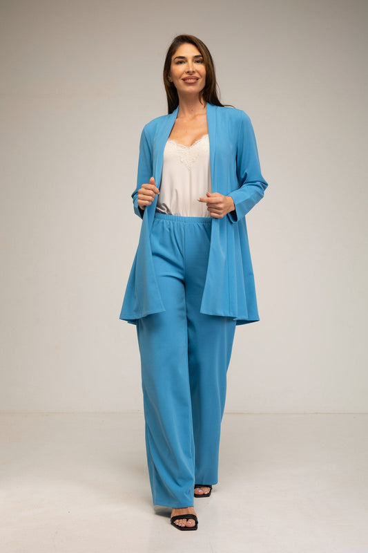 Woman wearing a blue suit with a plain background