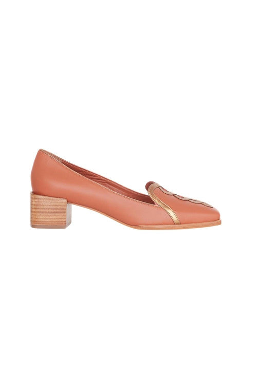 Coral-colored loafer with wooden block heel on a white background
