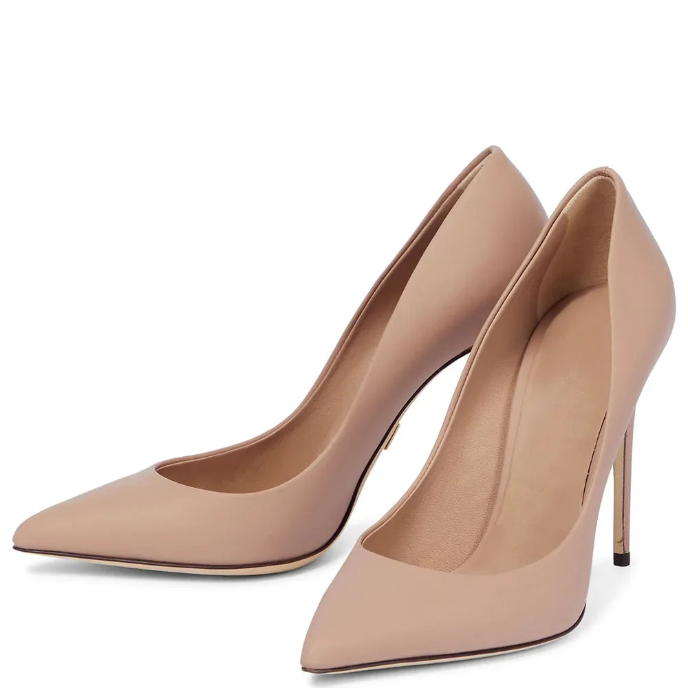 Pair of beige high-heeled shoes on a white background