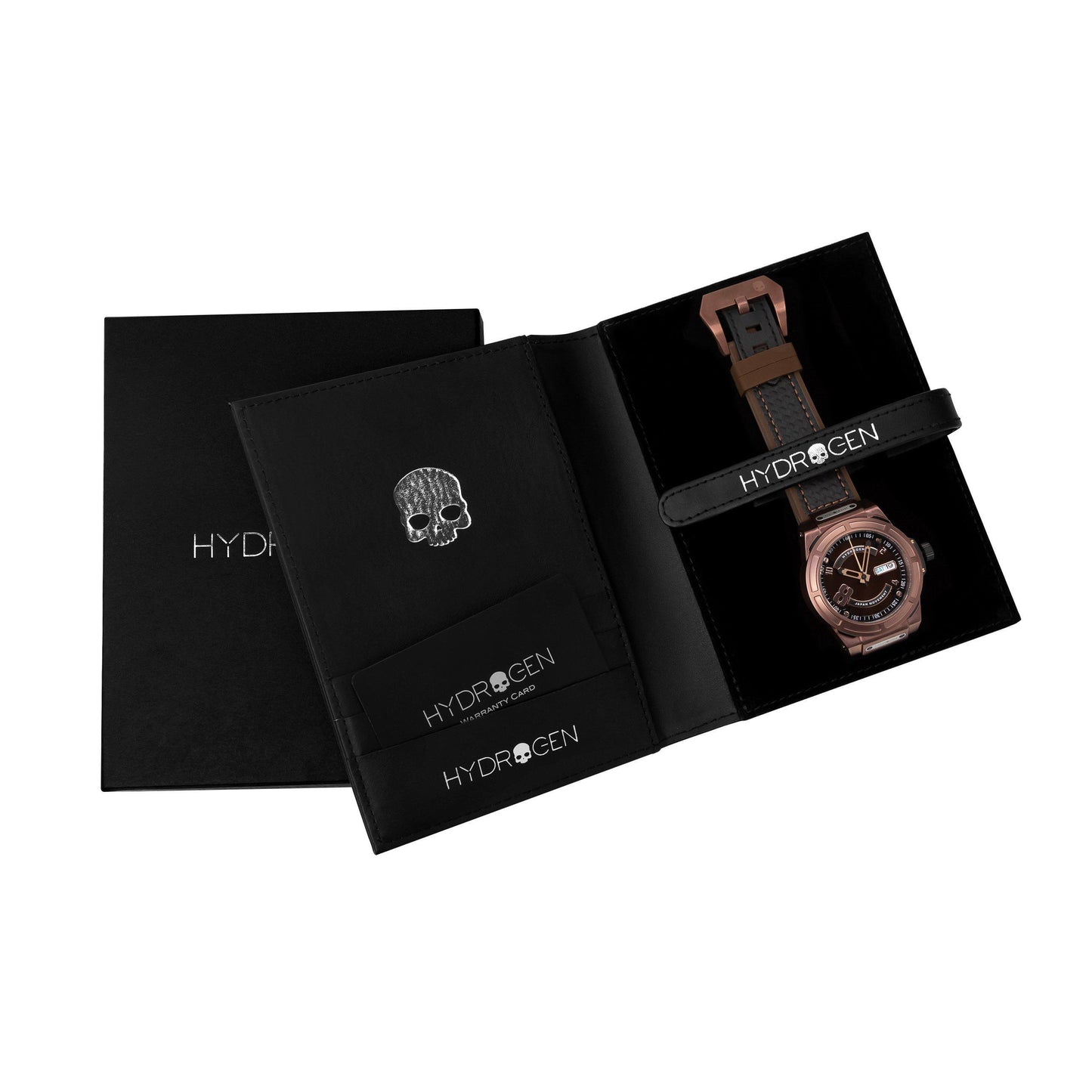Watch with brown leather strap and skull charm in a black Hydrogen box on a white background
