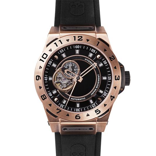 Rose gold watch with black strap and detailed face on a white background