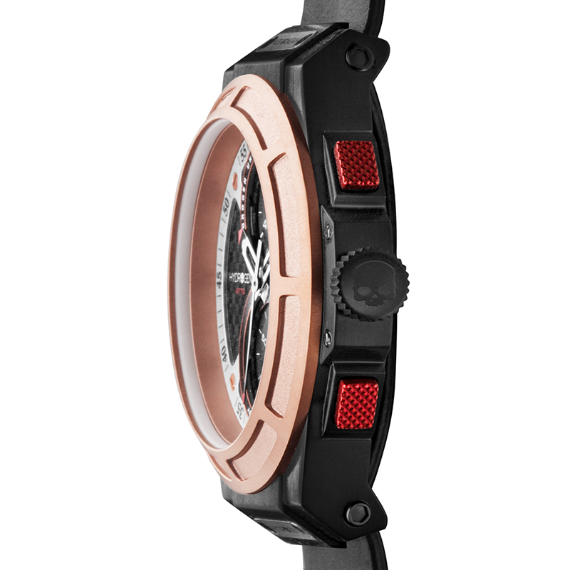Close-up of a watch with rose gold and black design on a white background