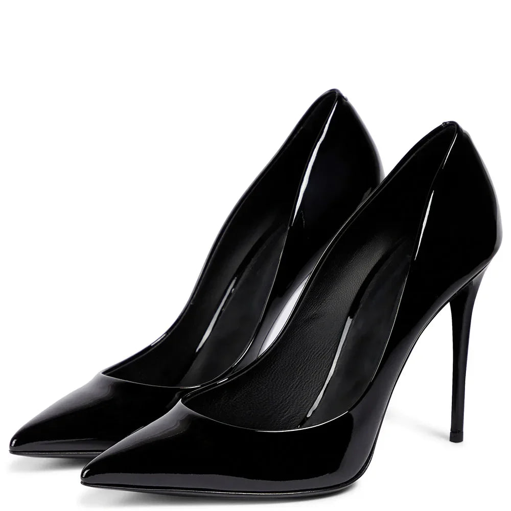 Pair of black high-heeled shoes on a white background