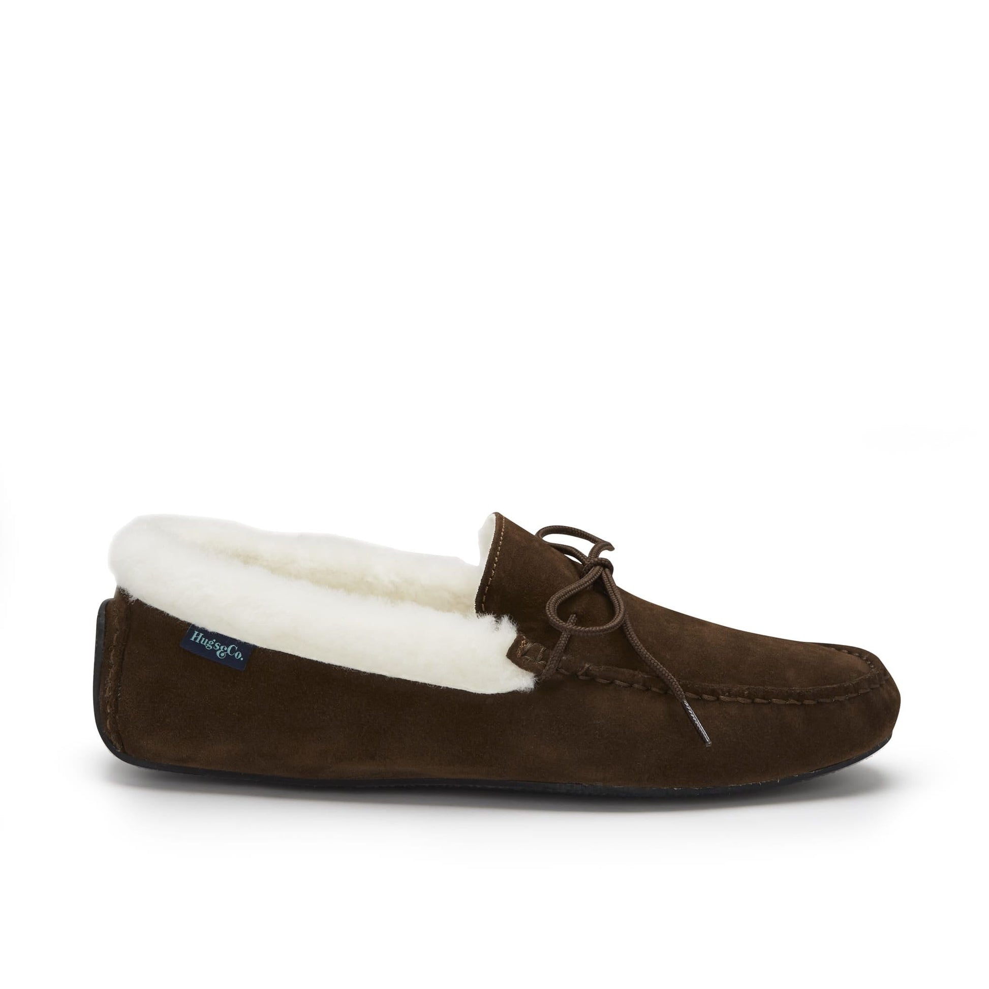 Brown moccasin slipper with white lining on a white background