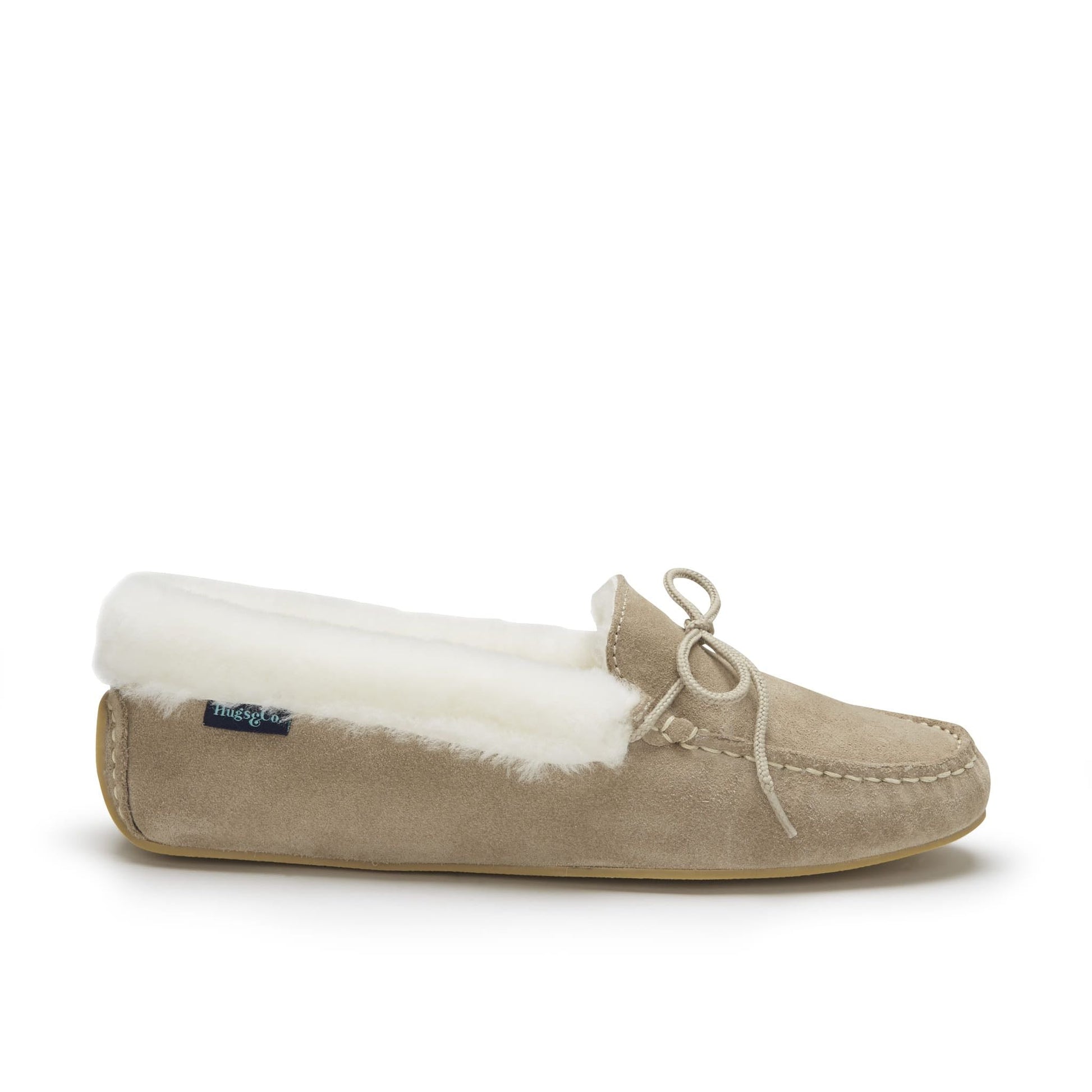 Beige slipper with white fur lining on a white background
