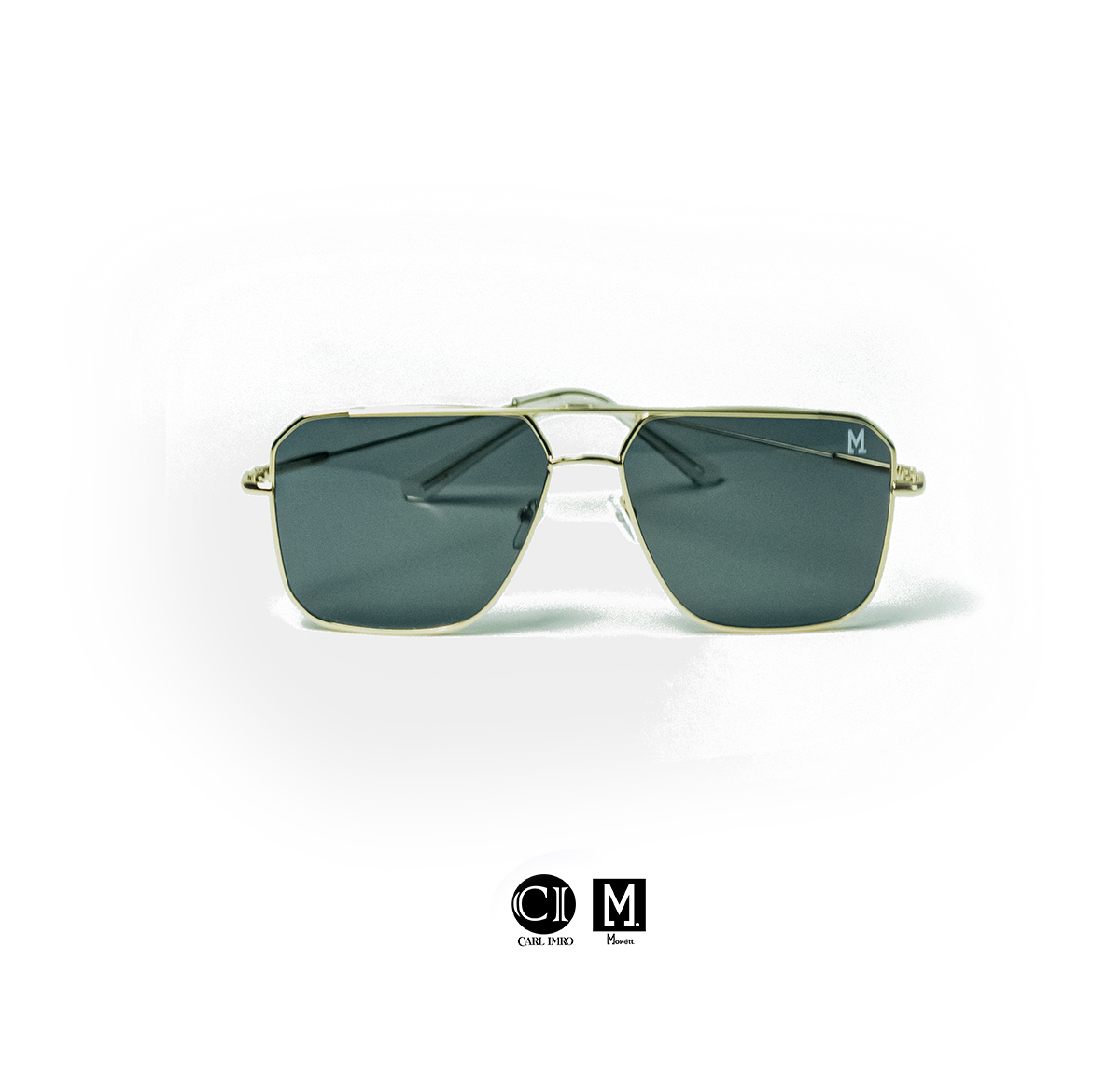 Gold-framed sunglasses with dark lenses on a white background