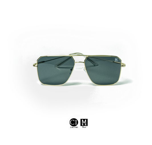 Gold-framed sunglasses with dark lenses on a white background