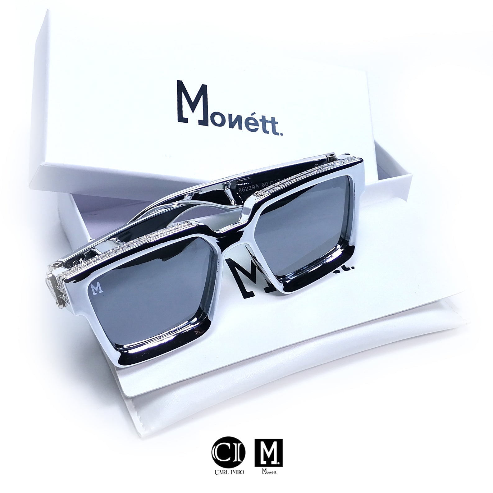 Sunglasses with diamond-studded frame on a white background, featuring the Monett brand.