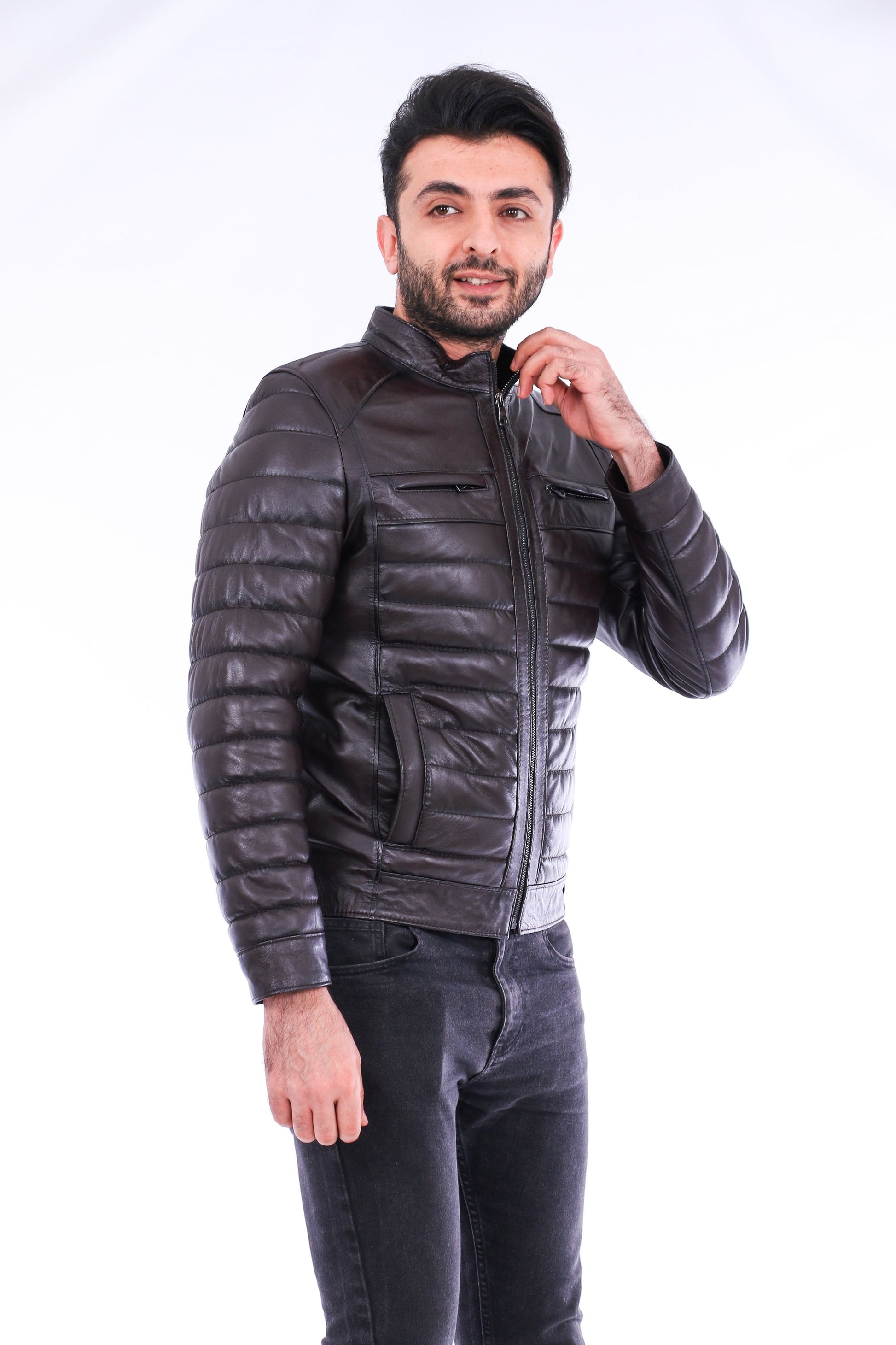 Man wearing a black leather jacket on a white background