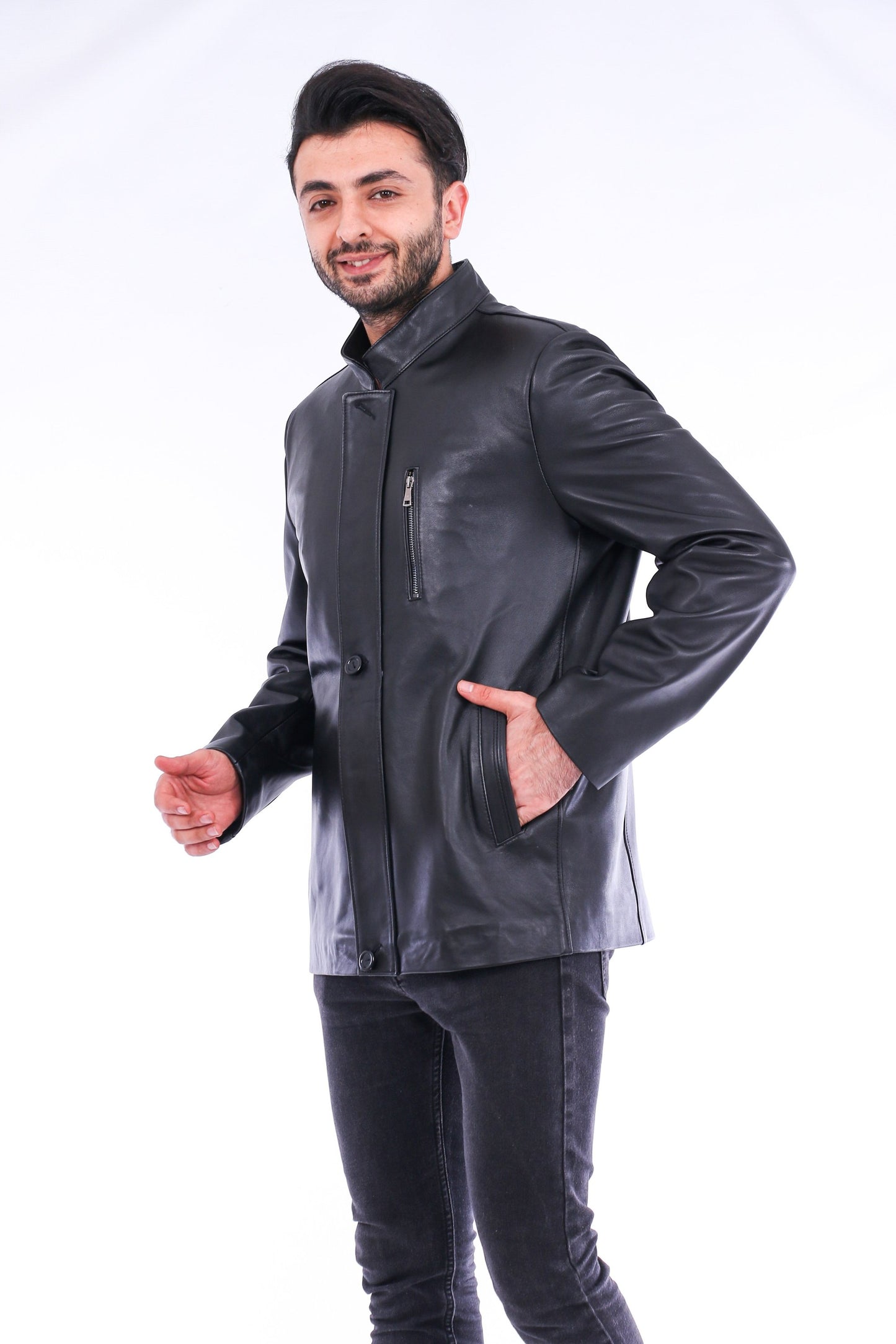 Man wearing a gray leather jacket on a white background