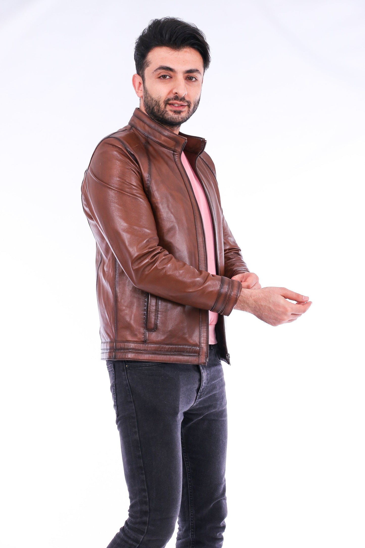 Man wearing a brown leather jacket on a white background