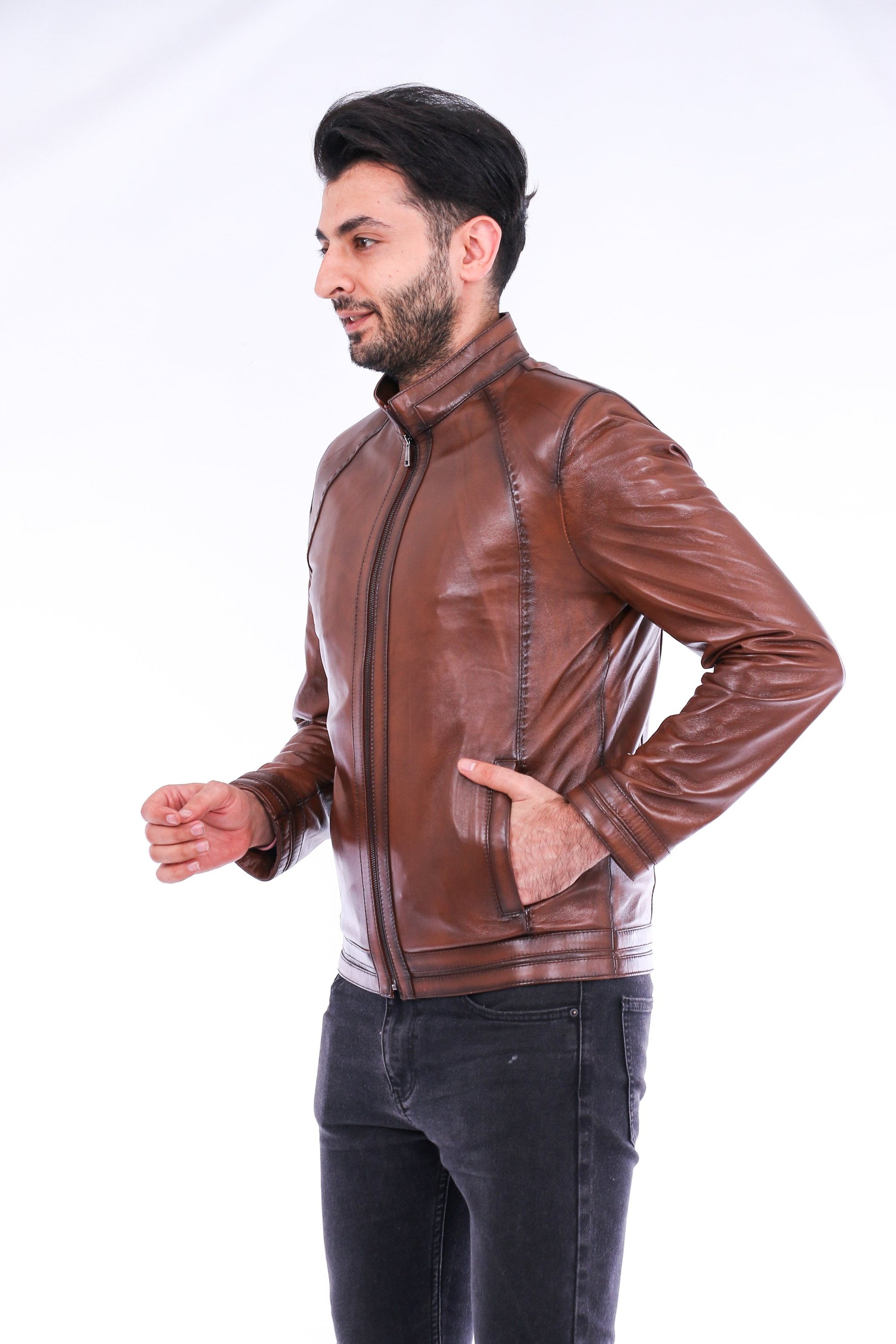 Man wearing a brown leather jacket on a white background