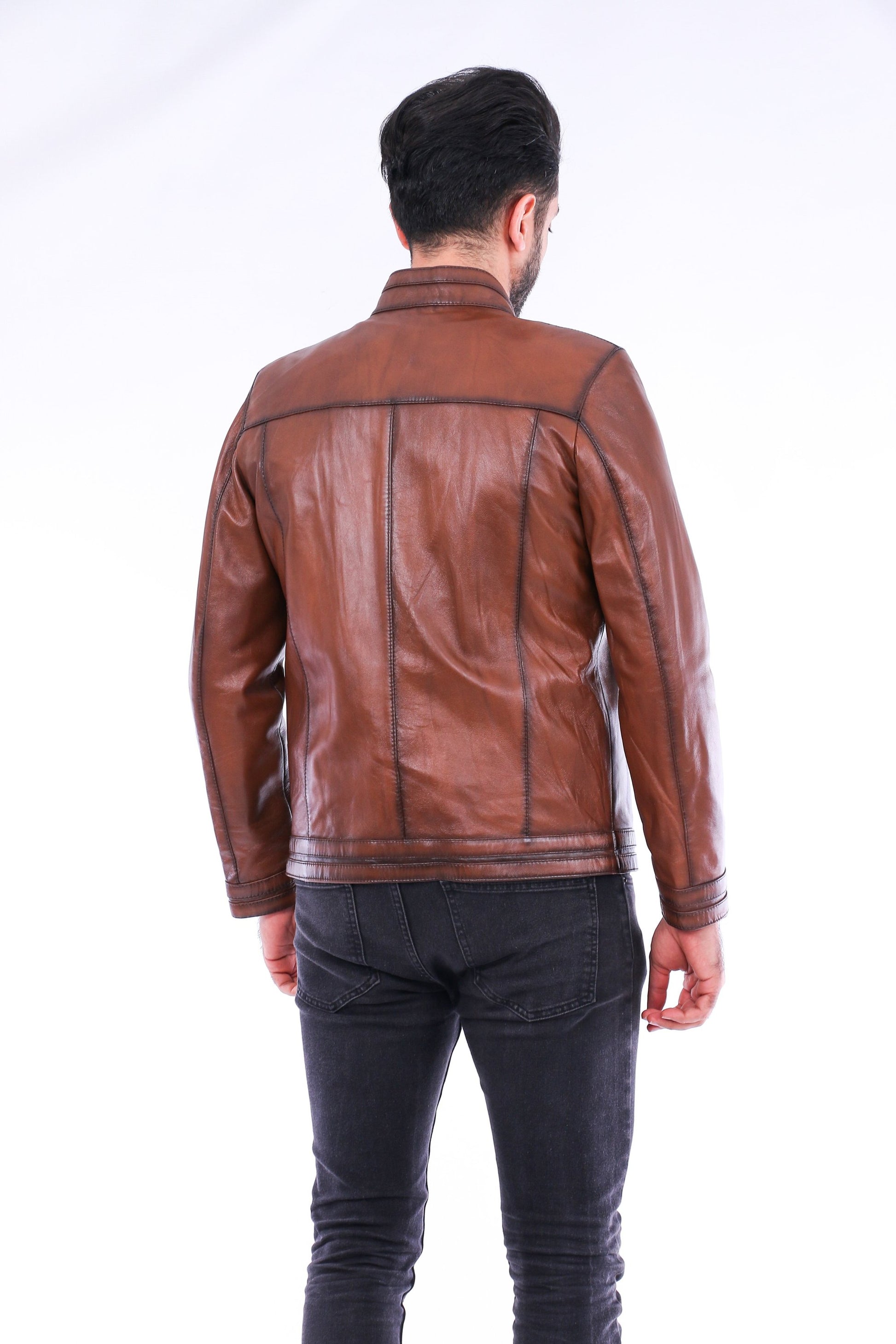 Man wearing a brown leather jacket on a white background