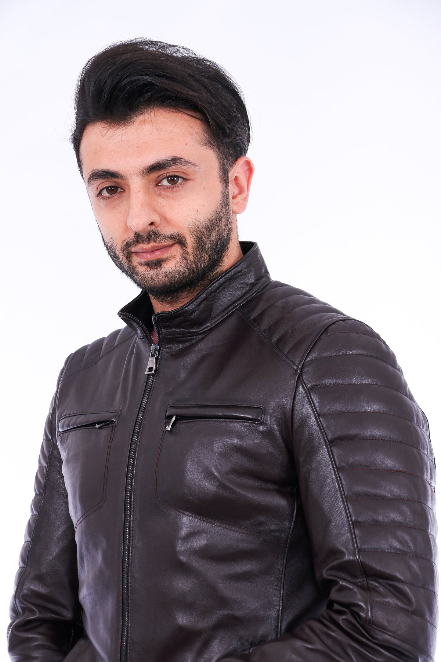 Man wearing a black leather jacket against a white background
