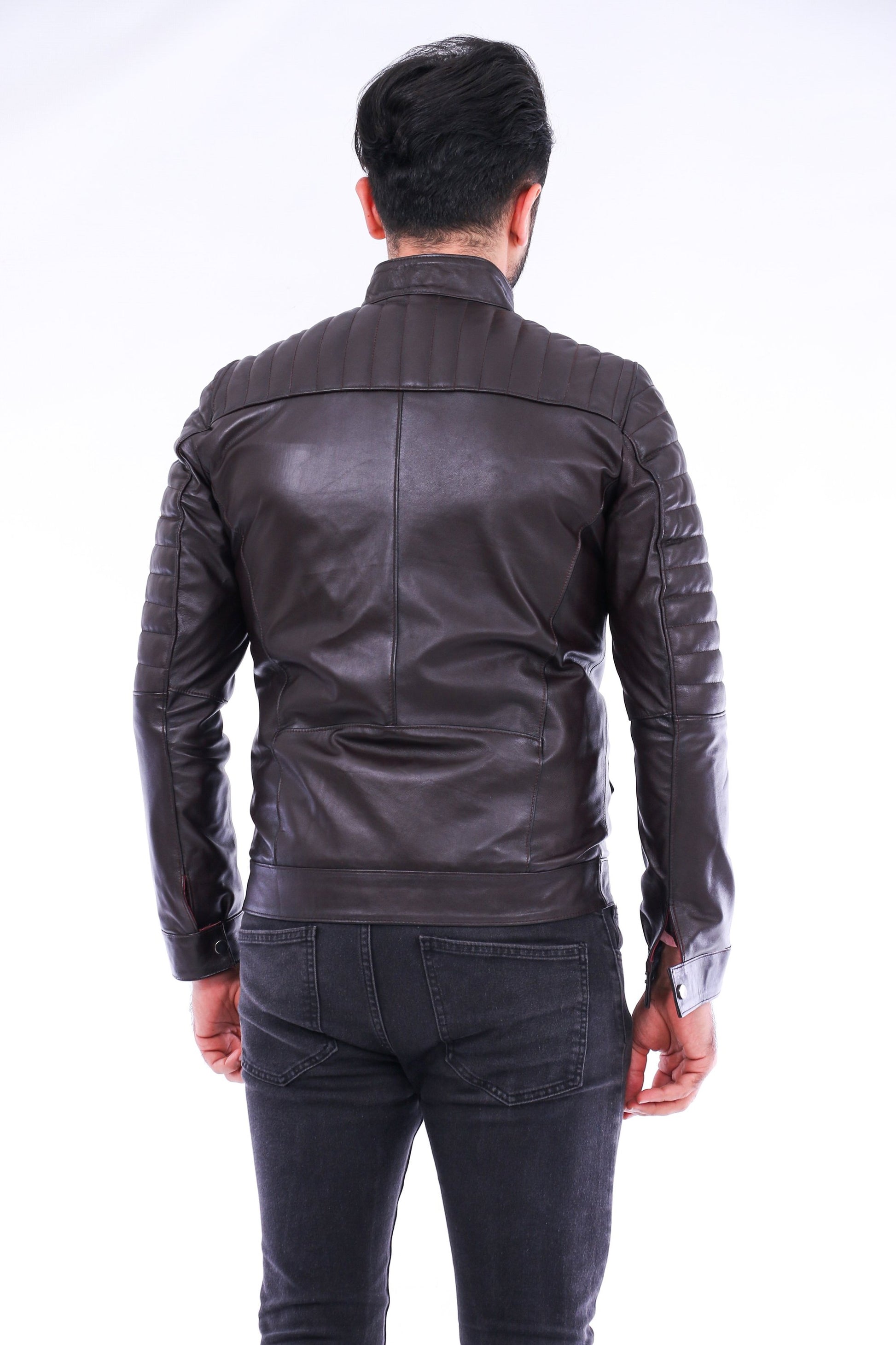 Person wearing a black leather jacket on a white background