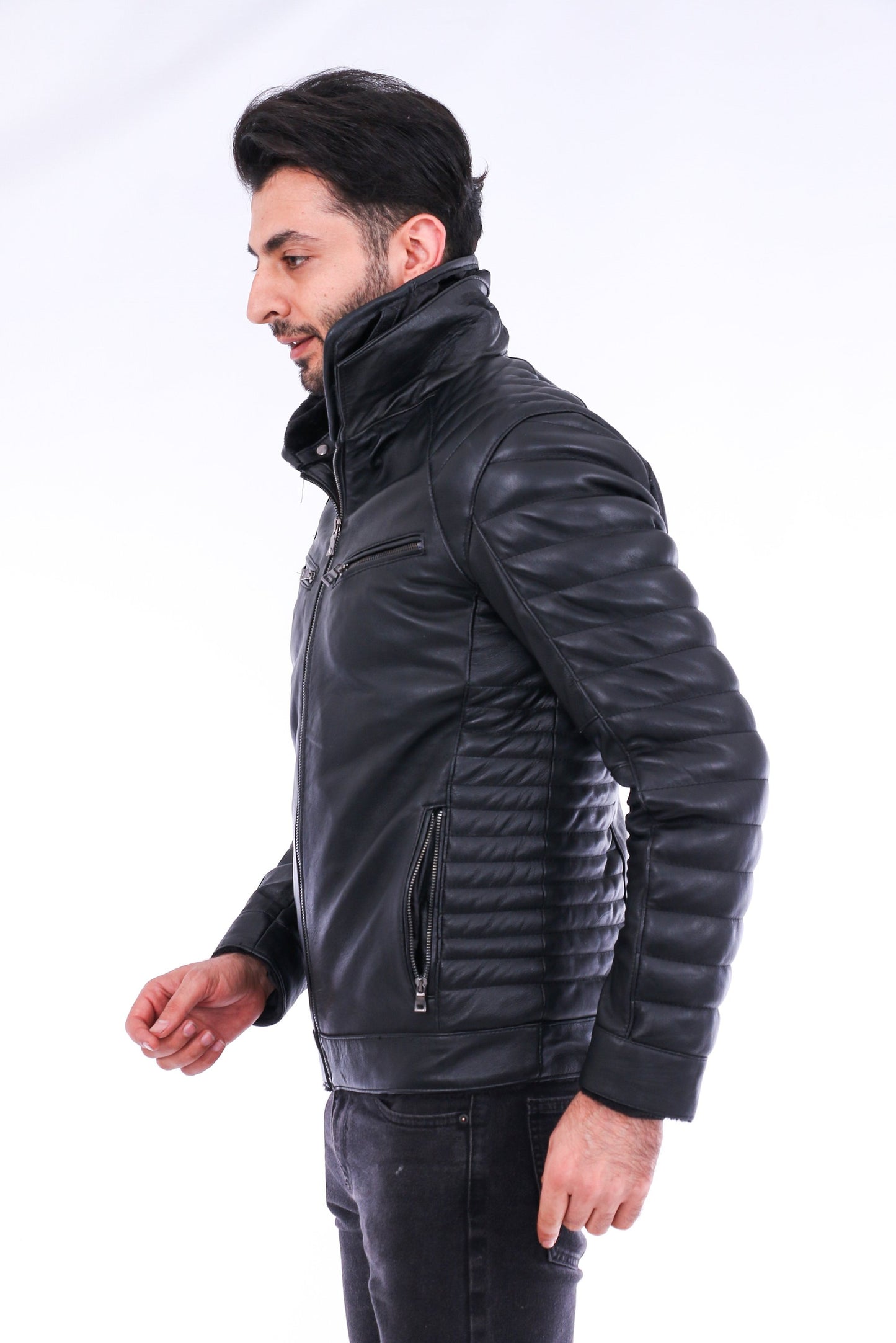 Man wearing a black leather jacket on a white background