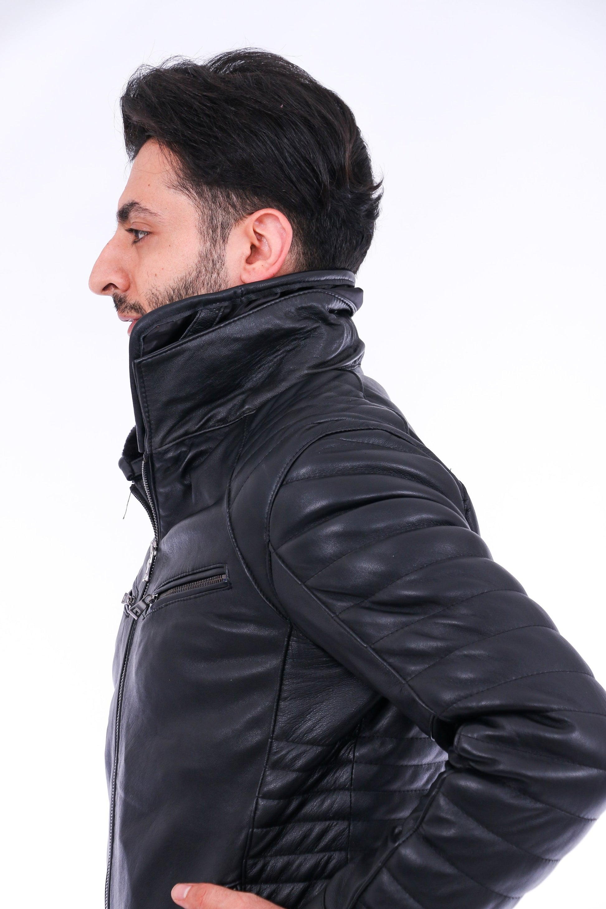 Man wearing a black leather jacket on a white background